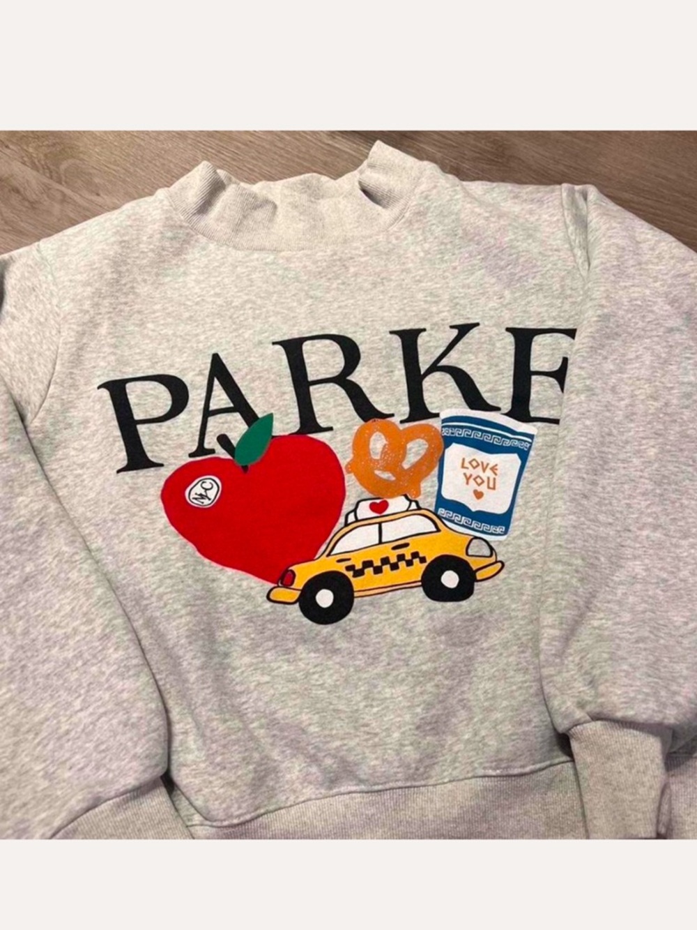 Parker Light Gray Graphic Sweatshirt with Red Apple and Yellow Taxi